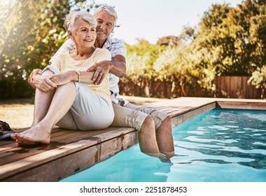 Senior couple, hug and relax by pool for love and summer vacation, bonding or quality time together in the outdoors. Happy elderly man and woman relaxing and hugging with feet in water by a poolside - Powered by Shutterstock