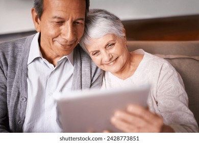 Senior, couple and hug with tablet on sofa for online bingo, crossword puzzle or internet games with smile. Elderly, man and woman with face, happiness or embrace with technology for web news in home - Powered by Shutterstock