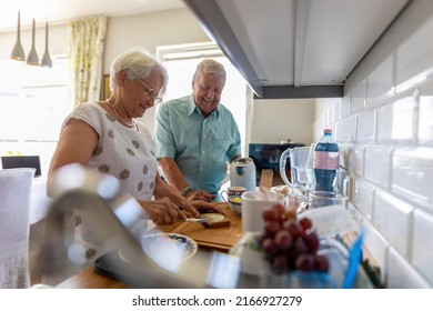 Senior Couple In A Kitchen Making Breakfast 
