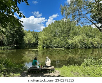 Senior Couple At The Lake Having A Picnic in summer. Old people  - Powered by Shutterstock