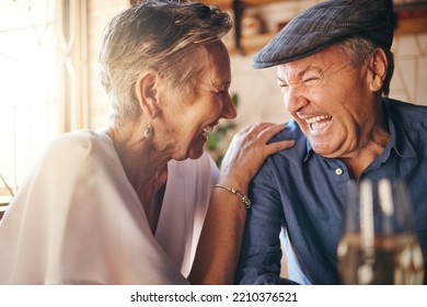 Senior, couple and laugh after comic joke together in restaurant for bonding time. Smile, man and woman in retirement laughing at funny conversation with love, happiness and comedy in cafe with wine - Powered by Shutterstock