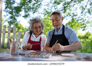 Senior couple learn how to make pottery. Leisure activity and lifestyle concept. - Powered by Shutterstock