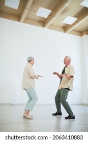 Senior Couple Learning The Dance During Lesson In Dance Studio