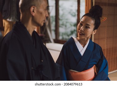 Senior couple lifestyle moments in a traditional japanese house. Man and woman from japan wearing kimono and spending time at home in Kyoto - Shutterstock ID 2084079613