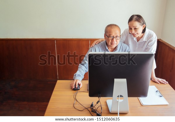 Senior Couple Looking Desktop Computer Desk Stock Photo Edit Now