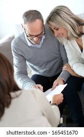 Senior Couple Meeting Financial Adviser For Investment