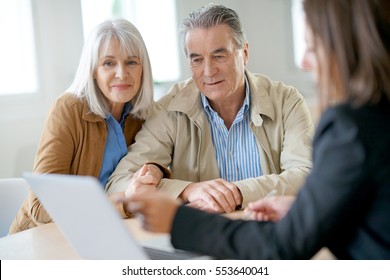 Senior Couple Meeting Financial Adviser For Investment                