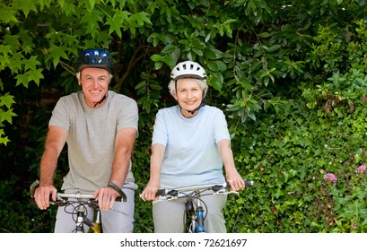 Senior Couple Mountain Biking Outside