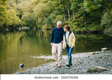 Senior couple are nejoying a walk around the Lake District together.