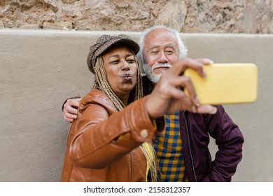 Senior Couple Old Asian Man And African American Woman, Make Selfie In The City, Traveling In Retirement