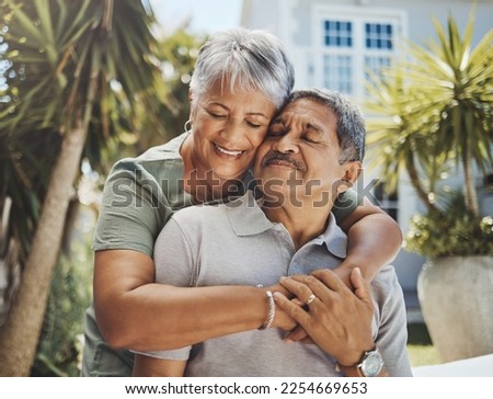 Senior, couple and old man and woman hug with love, care and support outside their home or house. Lovers, pensioner and elderly people enjoying retirement together with happiness in marriage