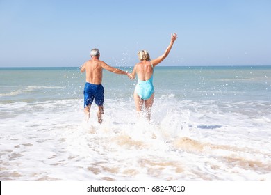 Senior couple on beach holiday - Powered by Shutterstock