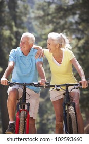 Senior Couple On Country Bike Ride