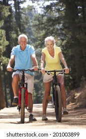 Senior Couple On Country Bike Ride