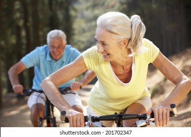 Senior Couple On Country Bike Ride