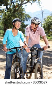 Senior Couple On Country Bike Ride