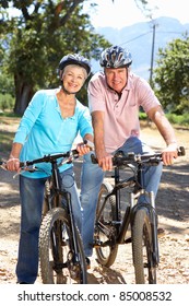 Senior Couple On Country Bike Ride