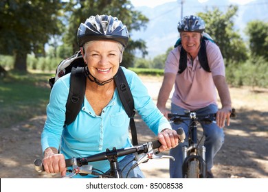 Senior Couple On Country Bike Ride