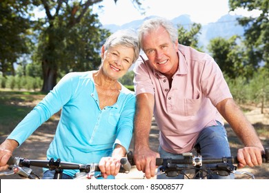 Senior Couple On Country Bike Ride