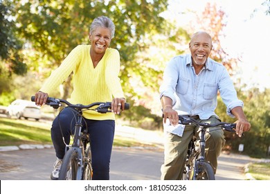 Senior Couple On Cycle Ride In Countryside - Powered by Shutterstock