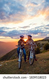 Senior Couple On Cycle Ride In Countryside