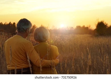 Senior Couple On Field Of Wheat 
