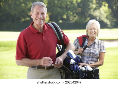 Senior Couple On Golf Course