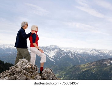 senior couple on mountain summit - Powered by Shutterstock