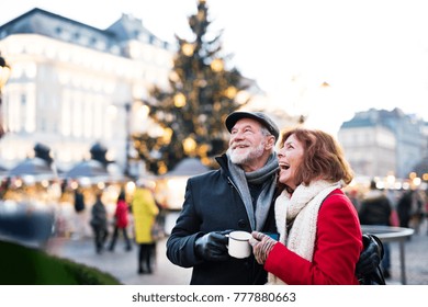 Senior couple on an outdoor Christmas market. - Powered by Shutterstock