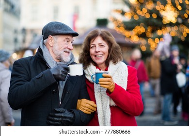 Senior Couple On An Outdoor Christmas Market.