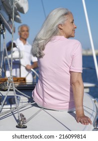 Senior Couple On Sailing Boat, Rear View Of Woman