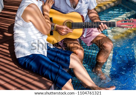 Similar – Young musician enjoying guitar on sunny day