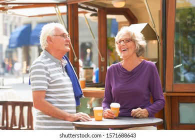 Senior Couple In Outdoor Cafe