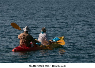 Senior Couple Paddling In A Kayak