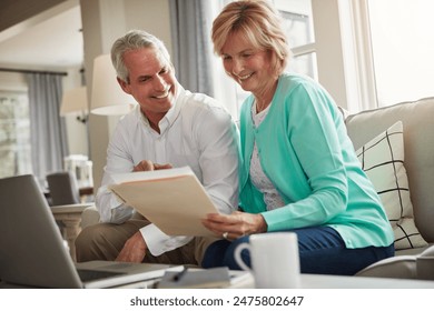 Senior couple, paperwork and laptop on sofa with discussion, smile and taxes in home. Old man, woman and computer with documents for compliance, reading and investment report with finance management - Powered by Shutterstock