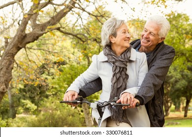 Senior couple in the park on an autumns day - Powered by Shutterstock