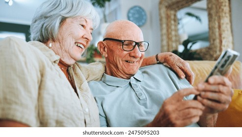 Senior couple, phone and relax on sofa for hug, choice and help with video, download and streaming in home. Elderly woman, man and smartphone on couch in lounge with thinking for post on social media - Powered by Shutterstock