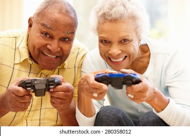 Senior Couple Playing Computer Games