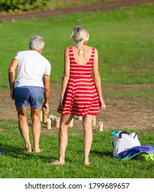 Senior Couple Playing Wooden Skittles