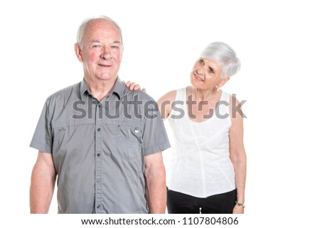 Senior couple posing on studio white background