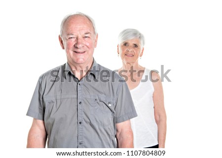 Senior couple posing on studio white background