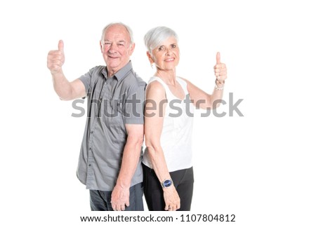Senior couple posing on studio white background