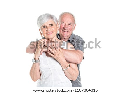 Senior couple posing on studio white background
