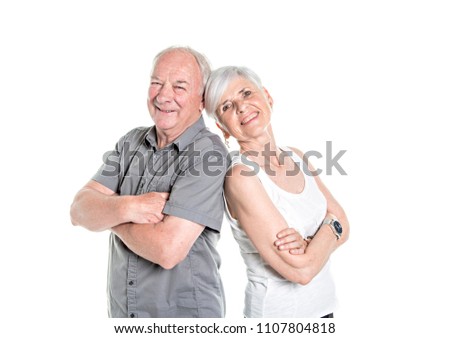 Senior couple posing on studio white background arm cross
