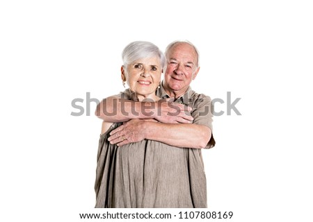 Senior couple posing on studio white background