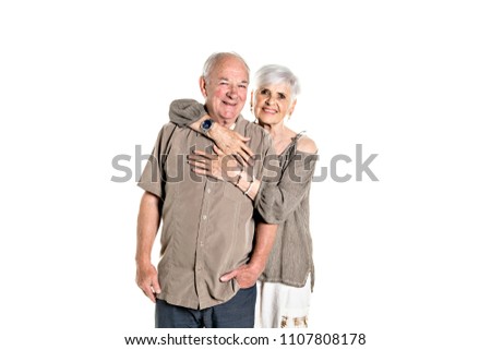 Senior couple posing on studio white background