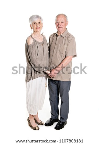 Senior couple posing on studio white background