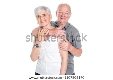 Senior couple posing on studio white background
