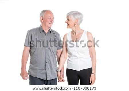 Senior couple posing on studio white background