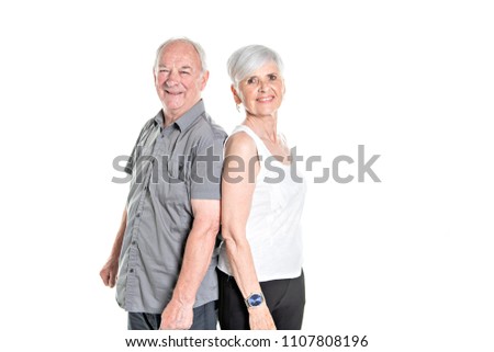 Senior couple posing on studio white background